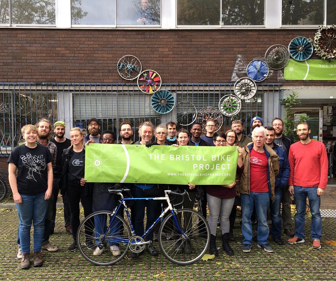 A picture of the Bristol Bike Project team outside the shop