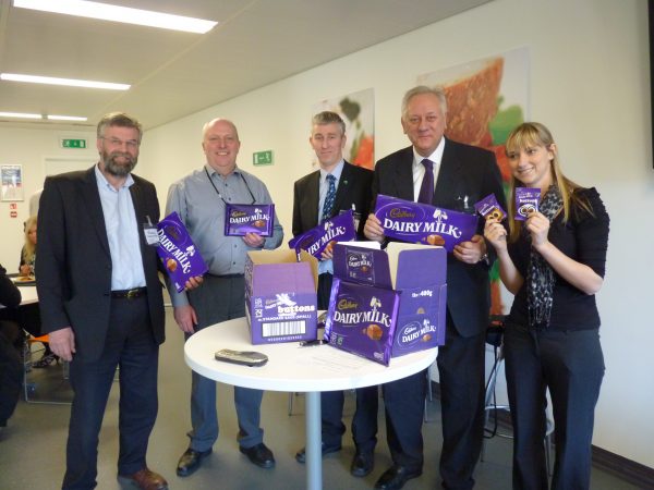 John Boyle, secretary of the Co-op Party (centre) with Paul Birch from Revolver (second from right) in Cadbury's hometown –Bourneville – when the company launched Fairtrade chocolate